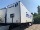 a semi truck that is parked on the side of the road