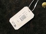 a tag with a price tag on it next to a pair of scissors