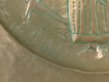 a glass plate with a picture of a woman and a bird on it