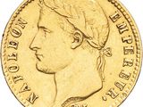 Gros plan sur une pièce d'or ornée d'une tête de femme