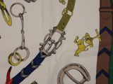 a picture of a scarf with a bunch of different items on it