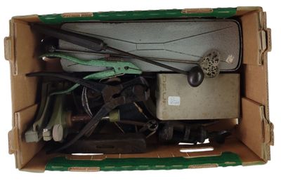 a cardboard box with a bunch of tools inside of it