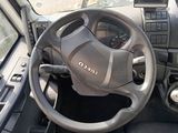 dashboard of a vehicle with a steering wheel and dashboard controls