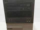 a close up of a dell desktop computer on a white surface