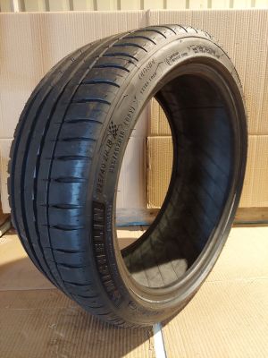a close up of a tire that is on a cardboard box