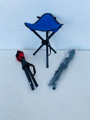 a blue chair and a umbrella on a white floor