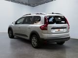 a silver car that is parked inside of a building