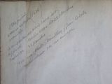 a piece of paper with writing on it sitting on a table