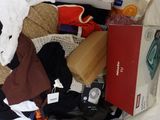 a pile of clothes and other items in a plastic bag