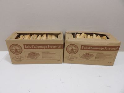 two boxes of food sitting on top of a table next to each other