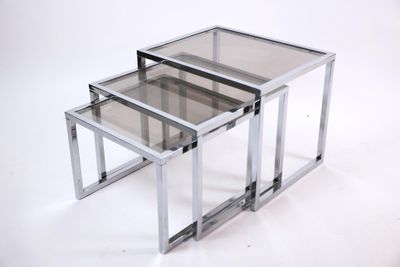 three glass nesting tables on a white background with a white background