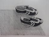 a drawing of a pair of tennis shoes on the floor