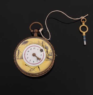 a pocket watch with a key hanging from it ' s chain