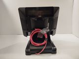 a small monitor with a red cord attached to it