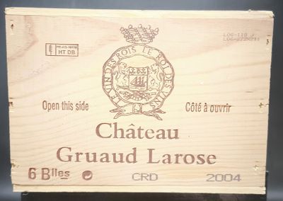 une caisse en bois sur laquelle est apposée une étiquette portant l'inscription « Château Grandu Larose »
