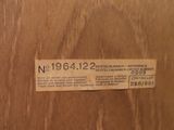 a label on the door of a wooden cabinet