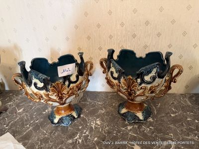 two vases that are sitting on a table