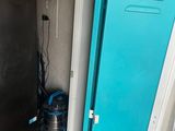 a blue locker with writing on it in a room