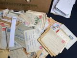 a box full of letters and envelopes on a table