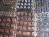 several stacks of coins are stacked on top of each other on a table
