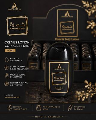 une boîte noire ornée d'une étiquette dorée sur laquelle figure un flacon noir de lotion
