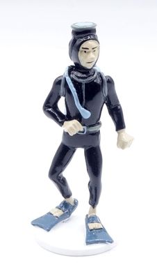 a figurine of a man wearing a diving suit and a helmet