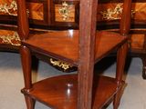 a wooden table with a shelf on top of it