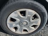 a close up of a tire on a white car