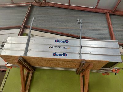 a metal box that is sitting on top of a wooden table