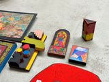 several pieces of art are laid out on the floor next to each other