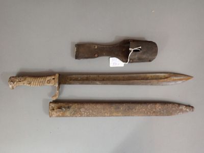 a knife, a knife blade, and a knife holder on a table