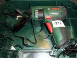 a green box with tools in it on the floor