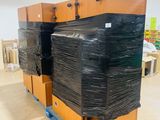a large stack of boxes sitting on a pallet in a warehouse