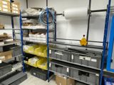 a room filled with shelves and bins and boxes