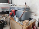a water tank sitting on top of a wooden box