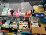 a glass shelf with books and other items on it
