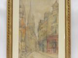 une image représentant un tableau d'une rue de la ville, dans un cadre doré