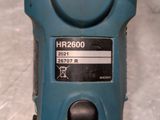 a close up of a blue machine on a table