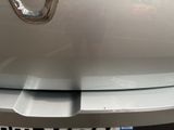 a close up of the front bumper of a silver car