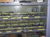 a large metal rack with many different types of guns