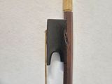 a knife that is on top of a wooden stick