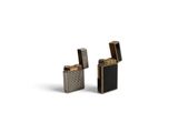 two lighters sitting next to each other on a white surface
