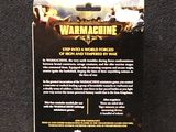 the back of a box of war machine cards on a black surface