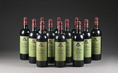 six bouteilles de vin rouge alignées sur une table