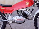 a red motorcycle parked on the side of the road