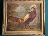 un tableau représentant un faisan, dans un cadre doré