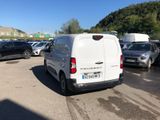 a white van that is parked in a parking lot