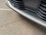 a close up view of a car ' s grille and front bumper