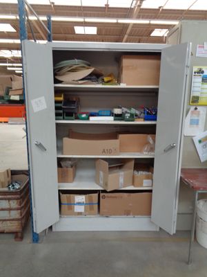 a large open storage cabinet in the middle of a room