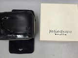 a wallet and a wallet case sitting next to each other